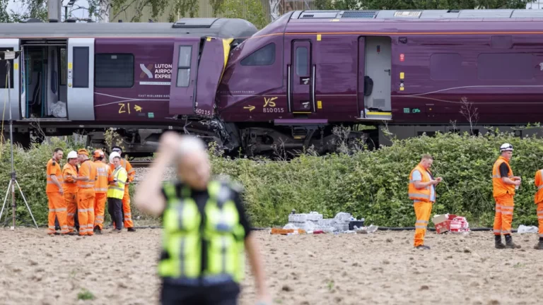 Two passenger trains have collided in the Bedford area, leaving a driver dead and dozens of passengers and crew injured.